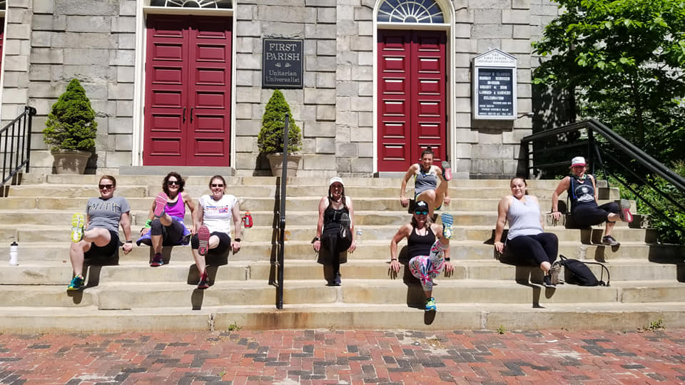 group on church steps doing tricep dips