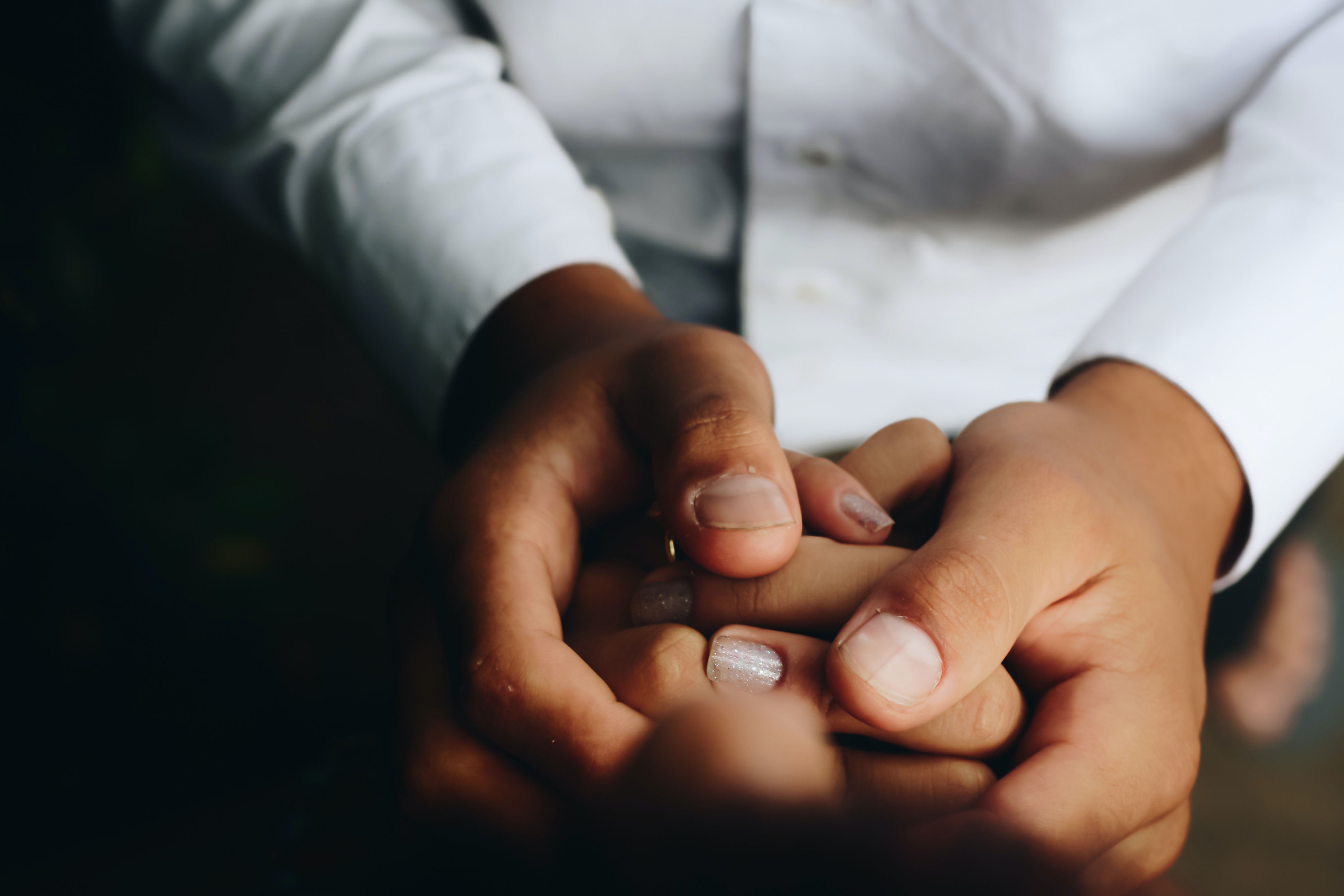 a doctor hold a patient's hands