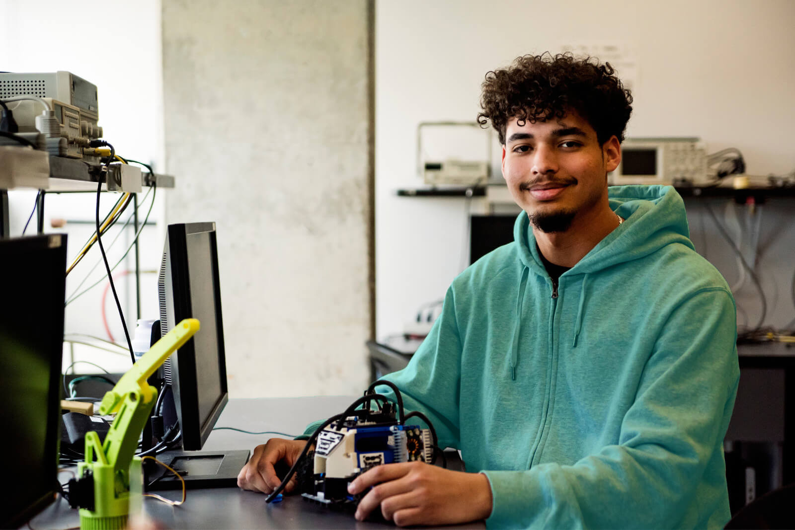 a student puts together a model in an architecture program