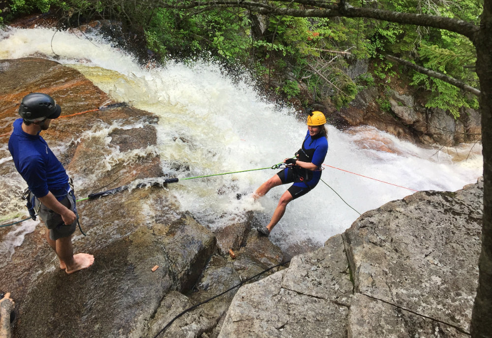 Waterfall rappelling with northeast mountaineering
